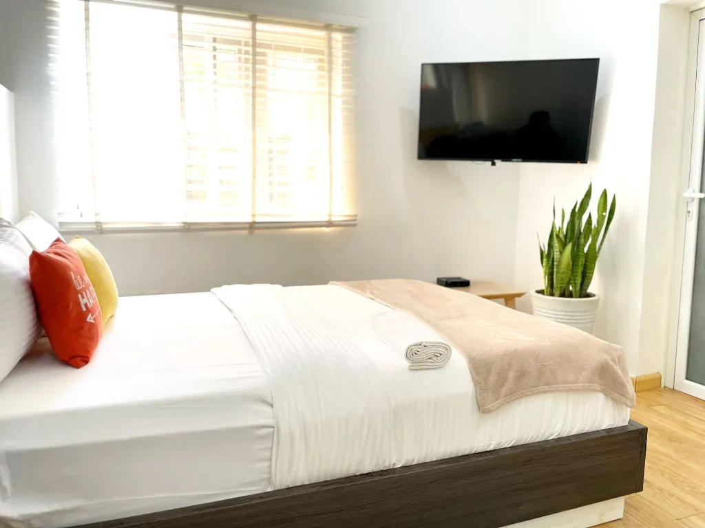 Canary Studio Bedroom room view with TV on-site.webp